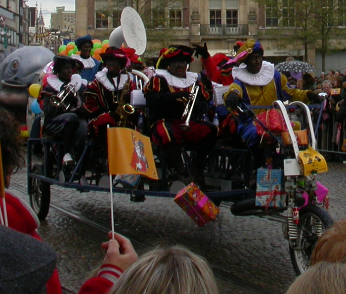 Zwarte Pieten on their tricycle